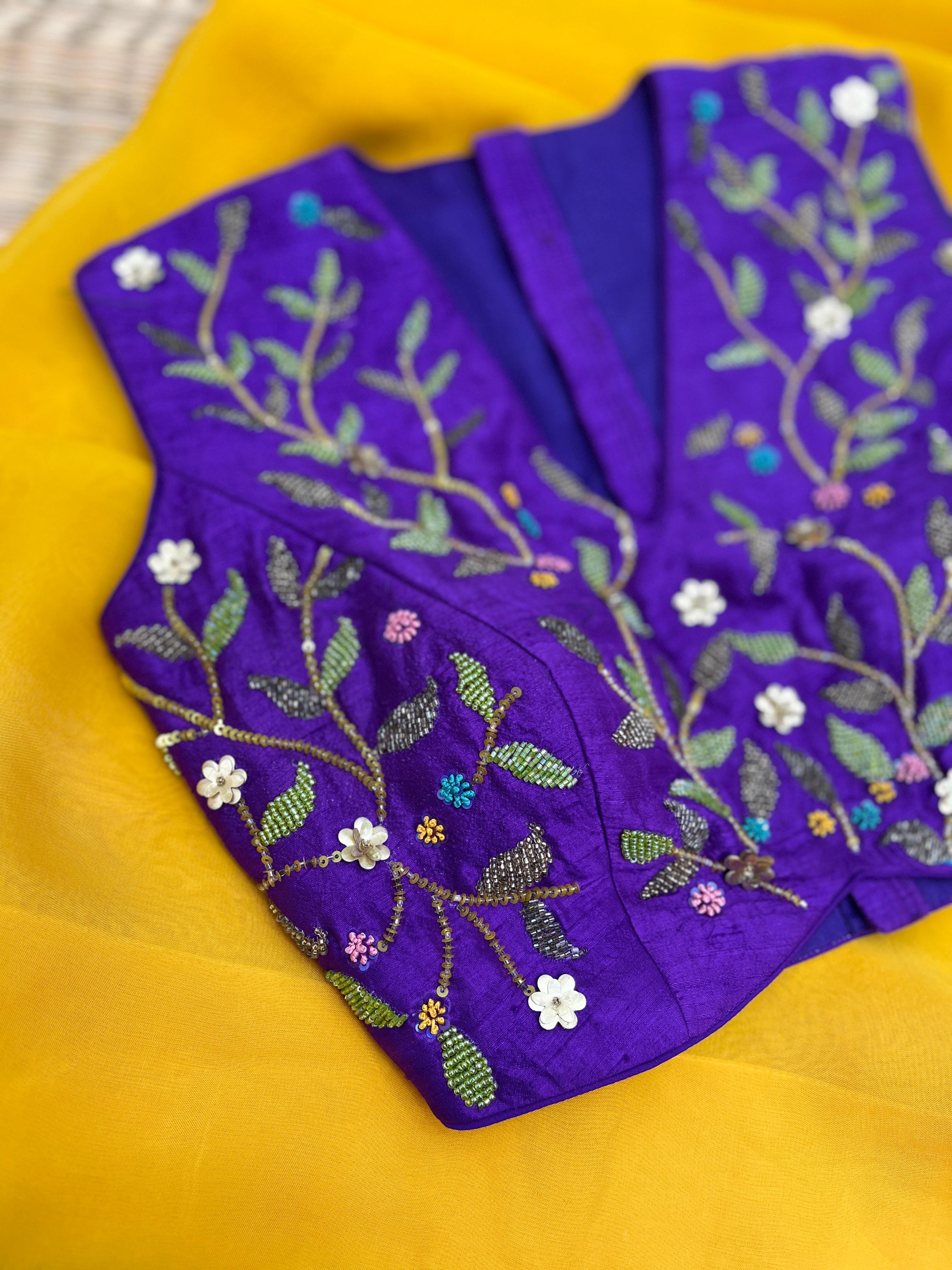 Yellow saree with Purple Blouse