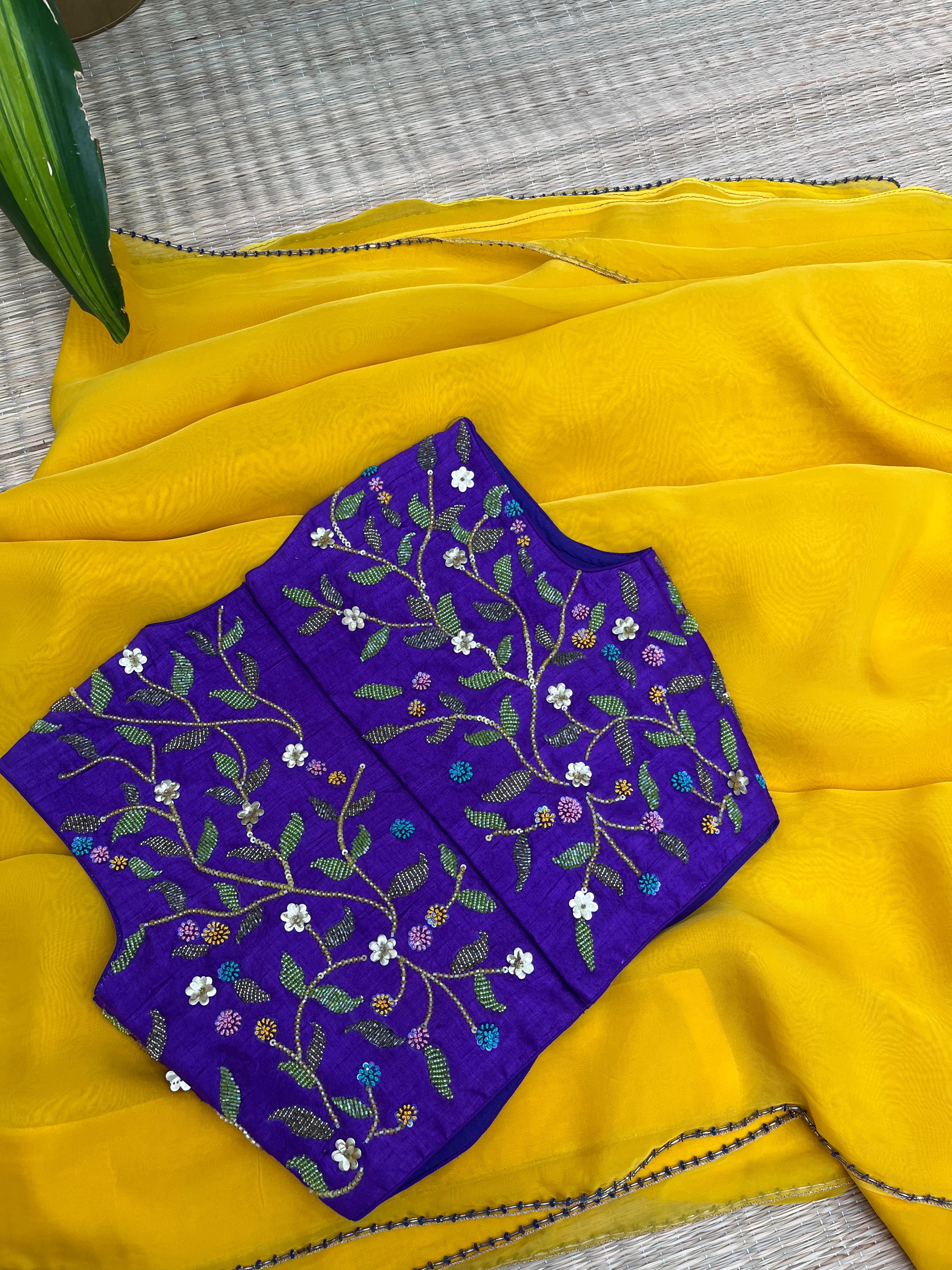 Yellow saree with Purple Blouse