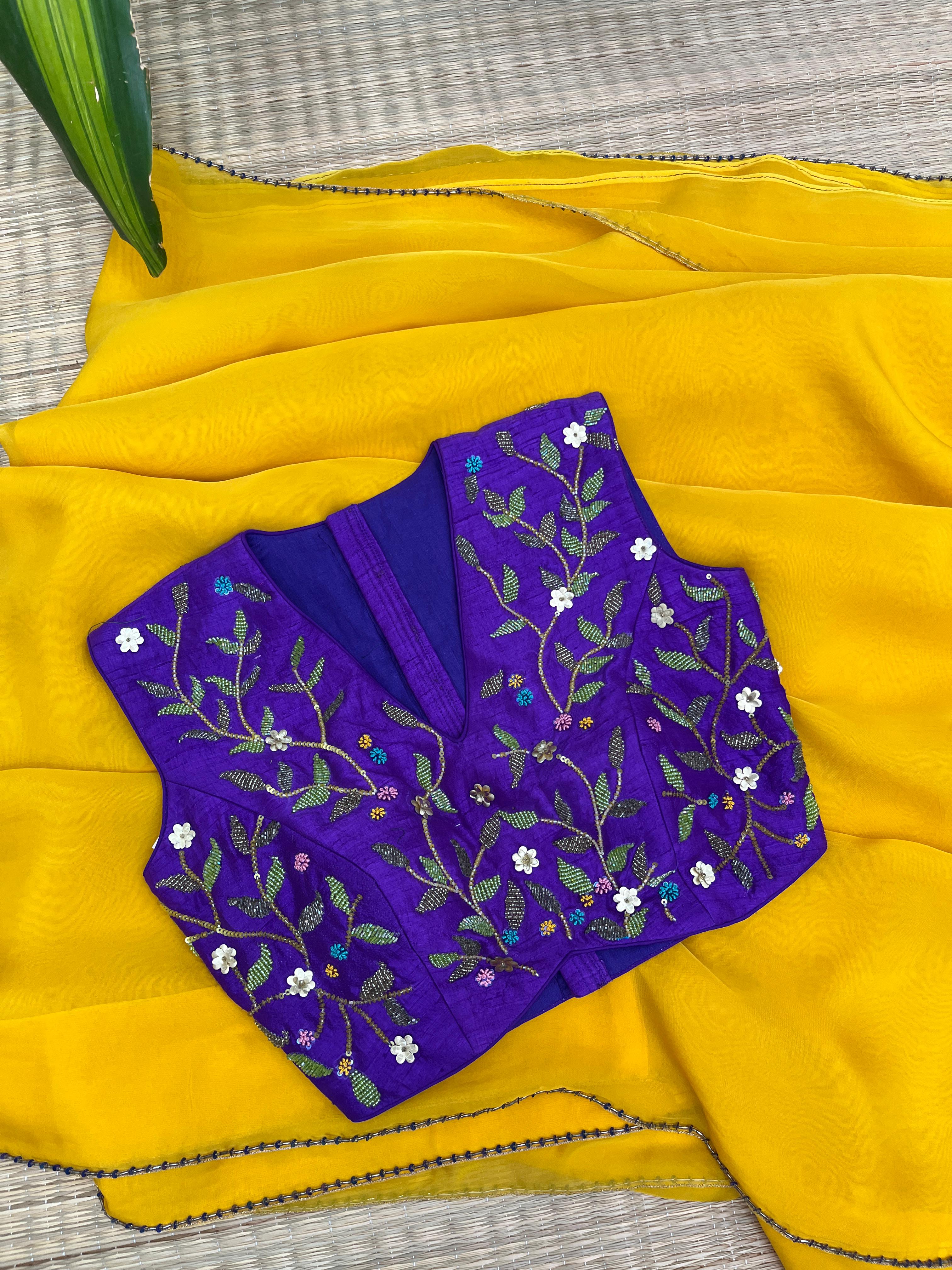 Yellow saree with Purple Blouse
